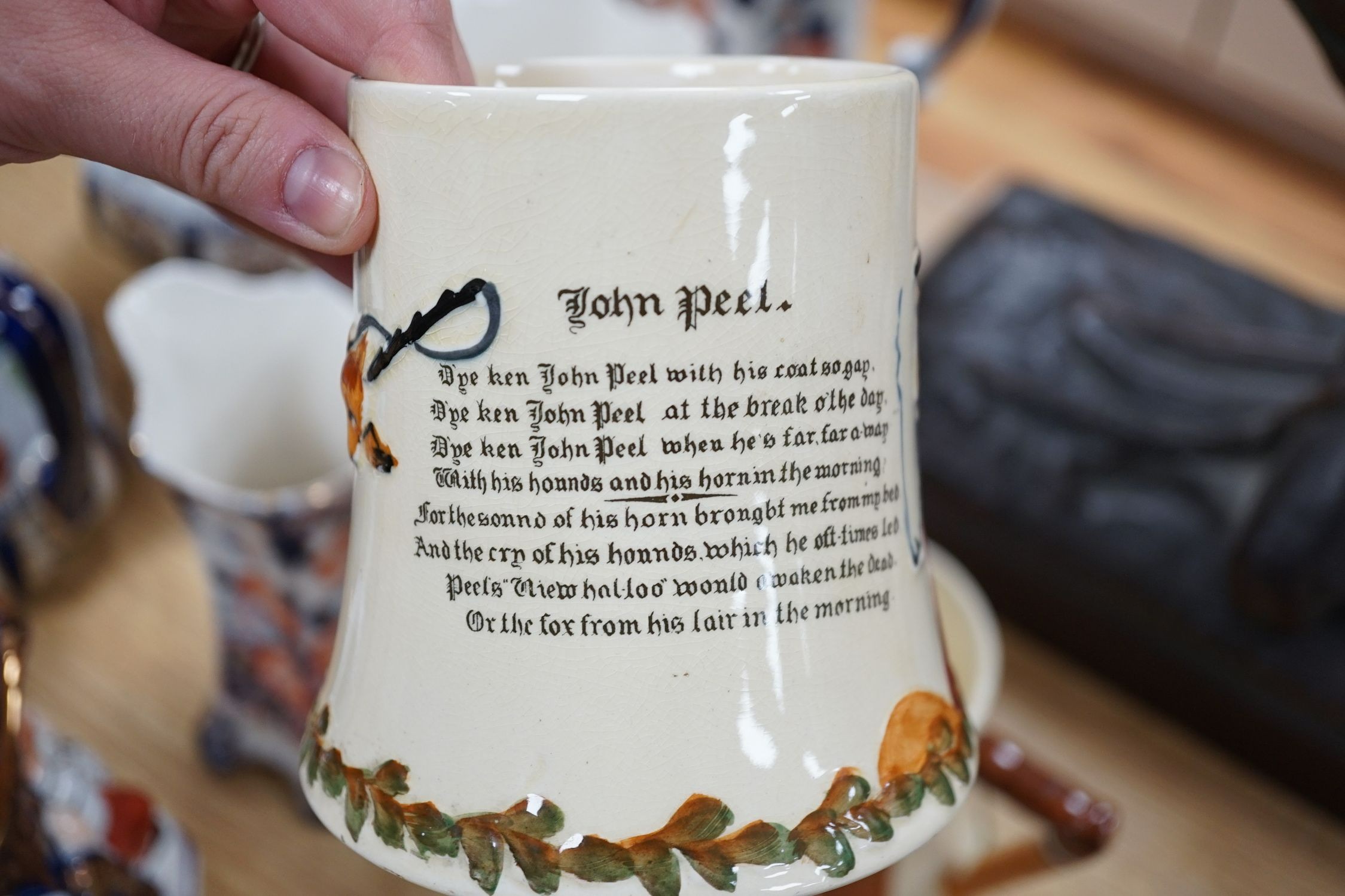 Two sets of Victorian graduated jugs, a Toby tea pot and two John Peel musical mugs